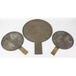 Three Japanese bronze mirrors. Each of circular form with handle. the largest cast with cranes in