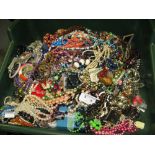 A bag containing a large quantity of costume jewellery. Many AF. Weight approximately 10.5kg. Due to