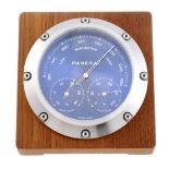 A Baro-Hygro Thermometer by Panerai. Stainless steel case with wooden surround. Reference OP6680,