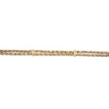 A 9ct gold bracelet. Of bi-colour design, the rope-twist double strand, with textured spacers and