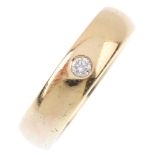 A 9ct gold diamond band ring. The brilliant-cut diamond, inset to the polished band. Hallmarks for