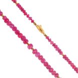 A ruby necklace. Designed as a series of graduated faceted ruby beads, with spherical bead