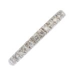 A diamond full eternity ring. Designed as series of pave-set brilliant-cut diamonds, with polished