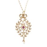 An Edwardian 9ct gold split pearl and garnet pendant. Of openwork design, the garnet and split pearl