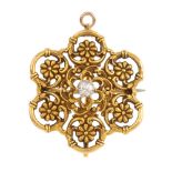 An American late Victorian diamond pendant. Of openwork design, the old-cut diamond, within a floral