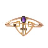 An Art Nouveau 9ct gold amethyst and split pearl brooch. Of geometric design, the angular and