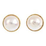 A pair of 9ct gold mabe pearl earrings. Each designed as a mabe pearl, within a rope-twist border.