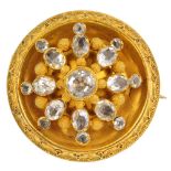 A mid Victorian gem-set brooch. The vari-shape quartz floral cluster, with textured bead spacers and