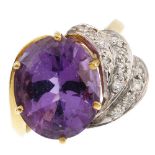 An amethyst and diamond dress ring. The oval-shape amethyst, with brilliant-cut diamond scroll side.