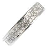 An 18ct gold diamond half eternity ring. The square-shape diamond double row, within a channel