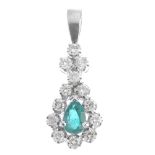 An emerald and diamond pendant. The pear-shape emerald with brilliant-cut diamond surround, spacer