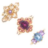 Four 9ct gold gem-set rings. To include a garnet and orange sapphire cluster ring, a blue topaz