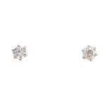 A pair of brilliant-cut diamond stud earrings. Estimated total diamond weight 0.25ct. Weight 0.