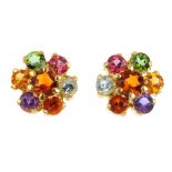 A pair of gem-set cluster earrings. Each of floral design, the circular-shape citrine, within a