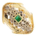 An 18ct gold emerald and diamond ring. The square-shape emerald, within a rose-cut marquise-shape