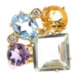 An 18ct gold gem-set dress ring. The kite-shape prasolite, with vari-shape amethyst, topaz and