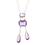 An early 20th century amethyst negligee pendant. The pear-shape amethyst duo drops, each suspended