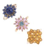 Four 9ct gold gem-set rings. To include a blue zircon, pink sapphire and diamond floral cluster