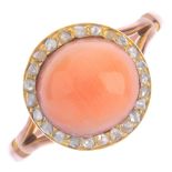 A mid 20th century 9ct gold coral and diamond ring. The circular coral cabochon, within a rose-cut