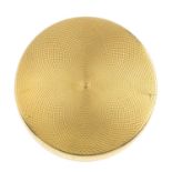 ASPREY & CO. - a 1920s 9ct gold snuff box. Of circular outline, with engine turned surface and glass