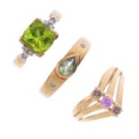 Five 9ct gold gem-set rings. To include a sapphire and diamond crossover ring, a peridot and diamond