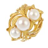 A cultured pearl dress ring. The cultured pearl line, with openwork foliate surround. Foreign marks.