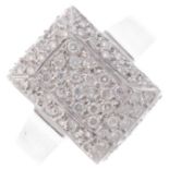 A diamond dress ring. Designed as a pave-set diamond rectangular panel, with similarly-cut diamond