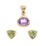 A 9ct gold pendant and earring. The pendant designed as an oval-shape amethyst with pear-shape