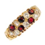 A garnet and diamond dress ring. The alternating circular-shape garnet and old-cut diamond lines,