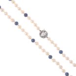 A cultured pearl single-strand necklace. Comprising of fifty-nine cultured and dyed cultured pearls,