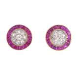 A pair of diamond and synthetic ruby earrings. Of circular outline, the pave-set diamond circular