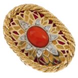 An 18ct gold coral diamond and enamel ring. The oval coral cabochon and brilliant-cut diamond