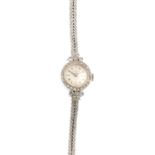 BAUME & MERCIER - a lady's diamond cocktail watch. The circular dial, with single-cut diamond