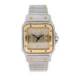 CARTIER - a Santos bracelet watch. Stainless steel case with yellow metal bezel. Reference 1566,