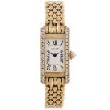 CARTIER - a Tank bracelet watch. 18ct yellow gold factory diamond set case. Numbered 828006 1339C.