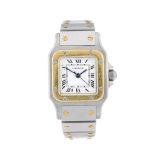 CARTIER - a Santos bracelet watch. Stainless steel case with yellow metal bezel. Numbered 090212385.