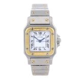 CARTIER - a Santos bracelet watch. Stainless steel case with yellow metal bezel. Numbered