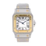 CARTIER - a Santos bracelet watch. Stainless steel case with yellow metal bezel. Reference
