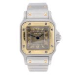 CARTIER - a Santos bracelet watch. Stainless steel case with yellow metal bezel. Reference 1567,