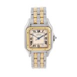 CARTIER - a Panthere bracelet watch. Stainless steel case with yellow metal bezel. Numbered