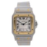 CARTIER - a Santos bracelet watch. Stainless steel case with yellow metal bezel. Reference 1566,