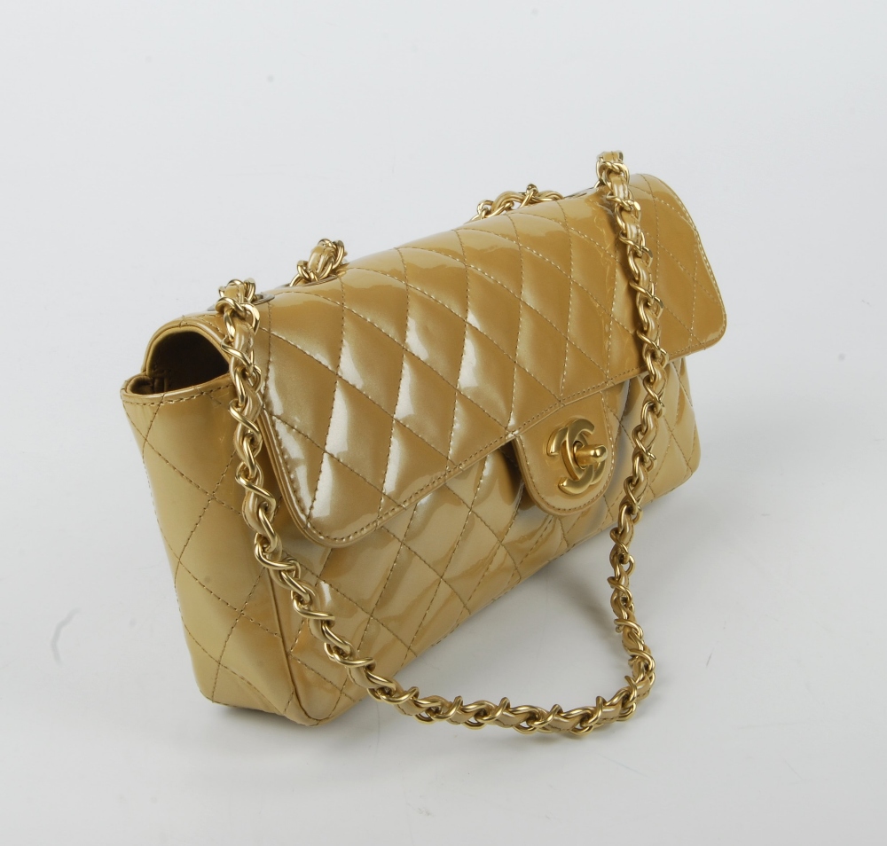 CHANEL - a gold patent leather flap handbag. Featuring a diamond quilted gold patent leather - Image 2 of 9