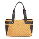 GUCCI - a handbag. Designed with a monogram patterned camel coloured canvas exterior and smooth