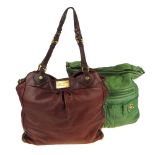 MARC JACOBS - two leather handbags. To include a burgundy leather handbag with gold-tone hardware,