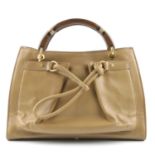 DONNA KAREN - a New York handbag. Featuring a beige leather exterior, large ruched front pocket with