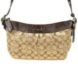 COACH - a Monogram handbag. Designed with a metallic gold fabric exterior with maker's signature