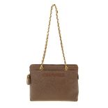 CHANEL - a 90s brown Caviar leather handbag. Crafted from brown textured caviar leather, featuring