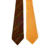 Two silk ties. To include an orange example by Salvatore Ferragamo, featuring a repeated sailboat