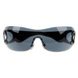 CHANEL - a pair of wide rimless sunglasses. Designed with one large grey tinted lens, with black