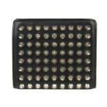 CHRISTIAN LOUBOUTIN - a Paros Spiked Bifold wallet. Crafted from smooth black leather accented